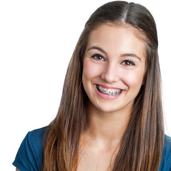 Close up portrait of Smiling Teen girl showing dental braces.Isolated on white background.